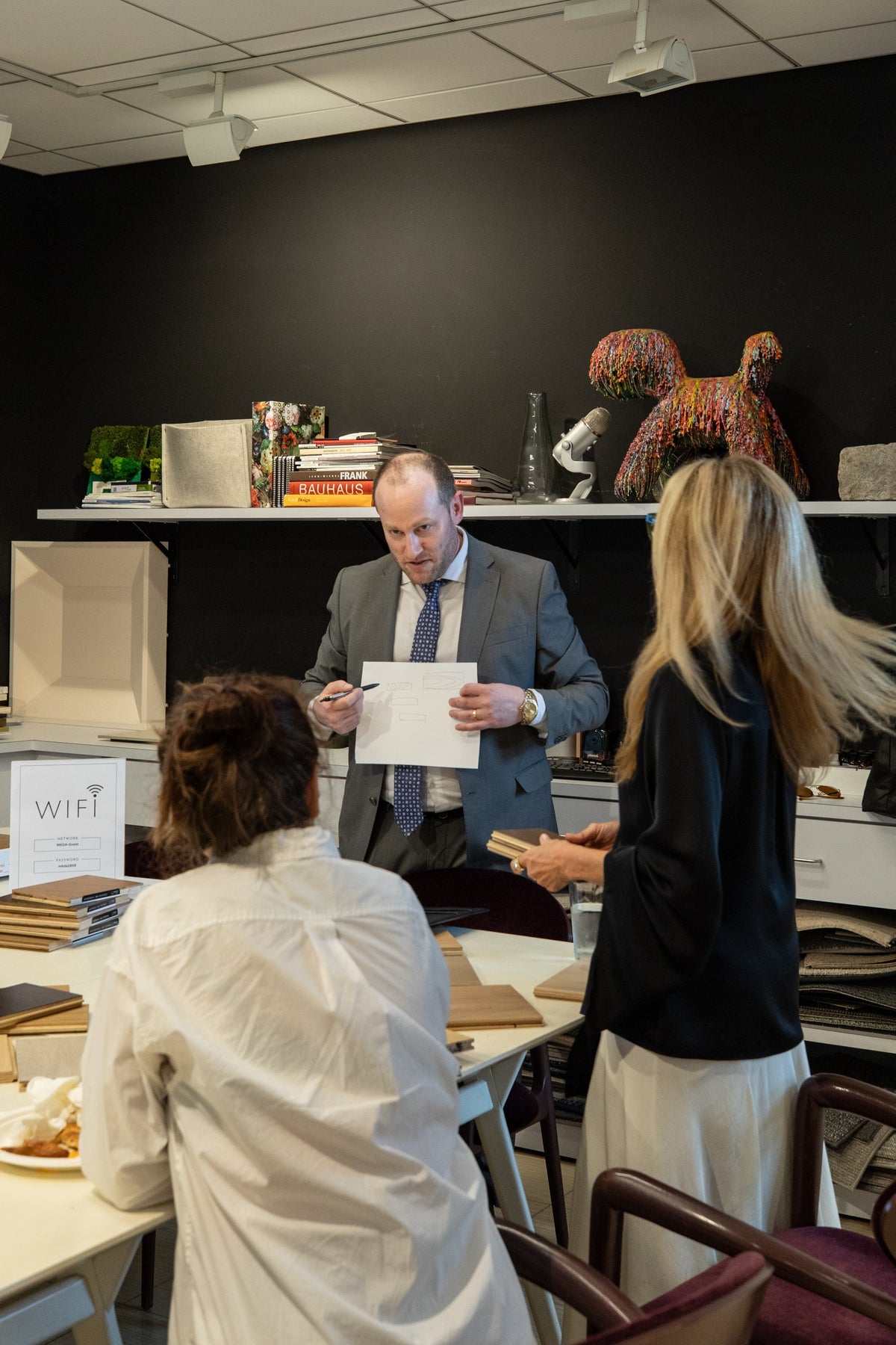 MKDA design team reviewing sustainable flooring materials with PID Floors