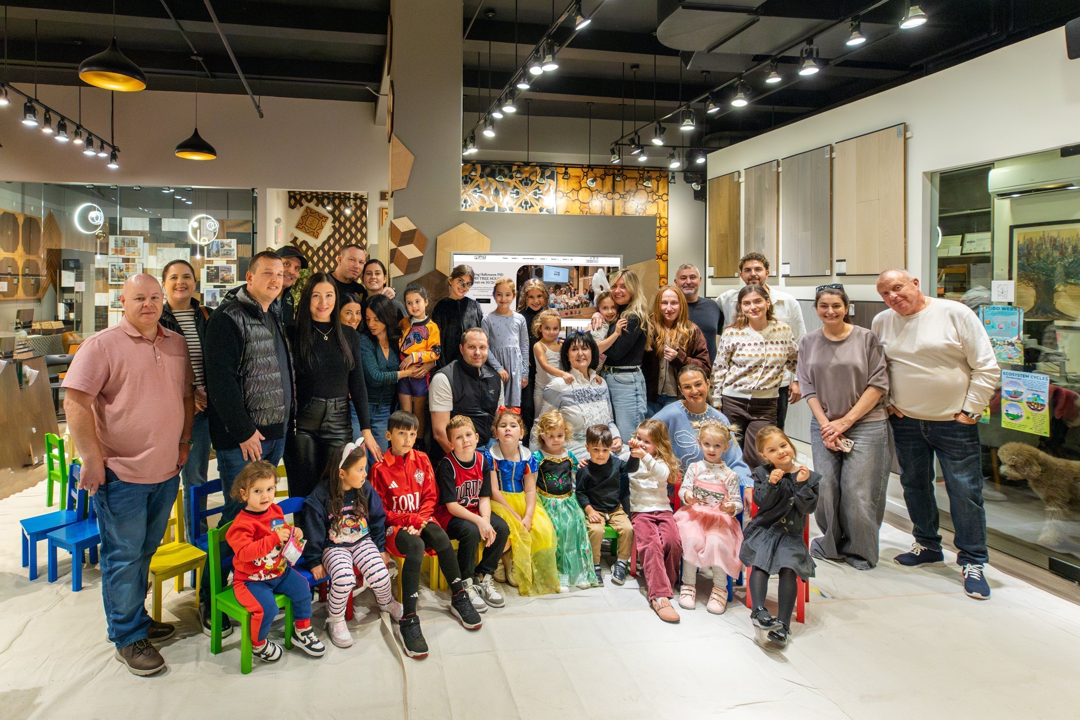 Group photo of attendees at PID Floors Halloween 2025 event